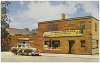 A color postcard depicting the Canoe Country Outfitters shop.