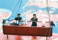 Photograph of Mansu (left) and Ch’ilsu (right) at work on the billboard that forms the backdrop to the famous final sequence of the film.