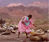 A still from the video “Bartolina Xixa: La colonialidad permanente” shows the artist dancing at the Hornillos garbage dump in northern Argentina.