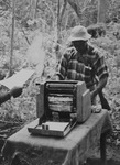 Fig. 18. A photograph of an armed person living in Frelimo’s liberated areas using a manual printer donated by one of Frelimo’s allies.