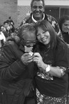 Photograph of Dona Hilda receiving her butterfly from Benedita.