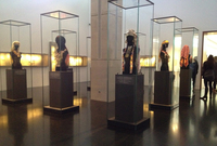 Photo of the Israel Museum Judaica and Jewish Ethnography Wing with glassed off female mannequins wearing Mizrahi necklaces and headdresses.