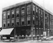 A black-and-white photograph of the first Canadian Canoe Company factory. The factory stood on Water Street in Peterborough from 1892–1904 near the rail office where all the canoes made in town were shipped.