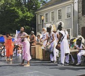 Color photograph of dance group on stage.