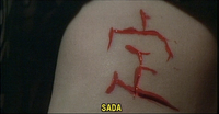 Sada carving her name on Kichi's arm