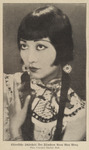 Black-and-white photograph from a German newspaper portraying Anna May Wong in a costume with makeup and hair in braids with decorations in them. It resembles the Klee portrait included in this chapter. We can only see her from the chest up, though her hand touches her hair as she looks up.