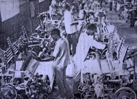 Weavers using mechanized looms at a Kano textile mill in the 1950s.