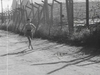 Film still showing Sonya along the barracks.