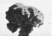 Black-and-white photograph of a mushroom cloud from a nuclear explosion.