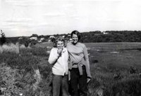 Black and white photograph of Elizabeth Bishop and Alice Methfessel standing outside side by side.