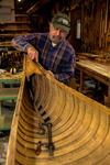 Rollin Thurlow working in his shop at Northwoods Canoe Company in Atkinson, Maine. Thurlow restores old wood-and-canvas canoes and builds his own Atkinson Traveler canoes along with new Morris, Rushton, and E. M. White boats.
