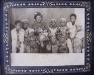 Black and white photograph showing Kaduna family members wearing cotton print garments.