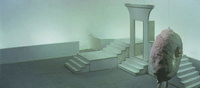 In the same shot, as Ōtsuka falls dead, the lighting turns a blanket white across the whole space, including the sculpture.