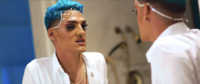 Two heads, front and back. Mirror reflection of Kevin Fret’s face with jewels attached to forehead. Back of Fret’s head.