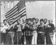 Fig. 1. Schoolchildren saluting the U.S. flag, April 1942. Many of those of Japanese descent were relocated to internment camps for the duration of the war.