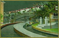 A postcard featuring an artist’s rendition of the Canals of Venice ride at Dreamland, Coney Island. A family rides a gondola along a small winding river of water that passes under a Venetian-style bridge.