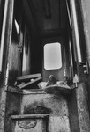 Fig. 63. An example of photographs taken at AIM, showing a dead victim of the Movene Massacre inside of the train carriage that Renamo had attacked.