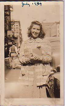 Lou Hotlzman's mother, Fannie, outside 99 Orchard Street